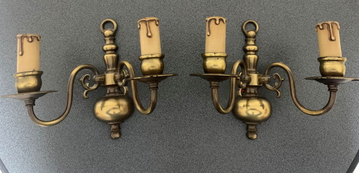 Two two-armed brass wall light