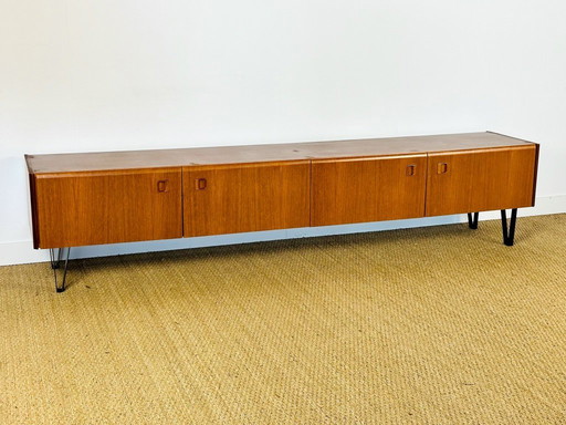 Low Scandinavian teak sideboard with metal compass legs, 1960