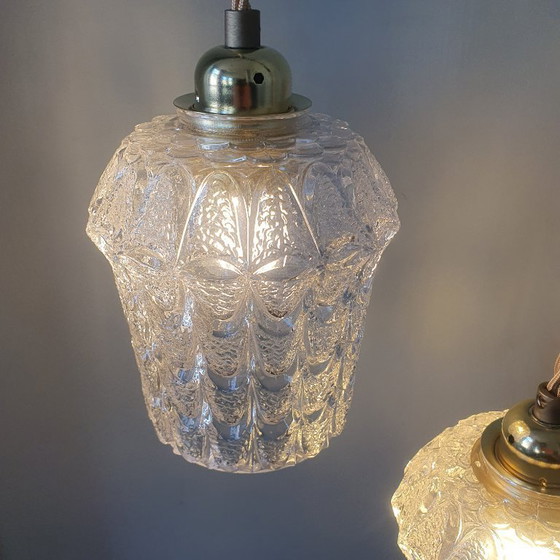 Image 1 of Set of two vintage Mic Century pendant lamps of thick, textured glass.