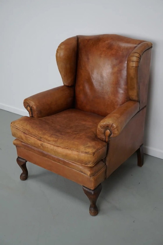 Image 1 of Vintage Nederlandse cognackleurige leren clubfauteuil met voetenbank