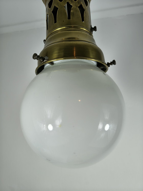 Image 1 of Ciondolo in ottone con sfera in vetro opalino