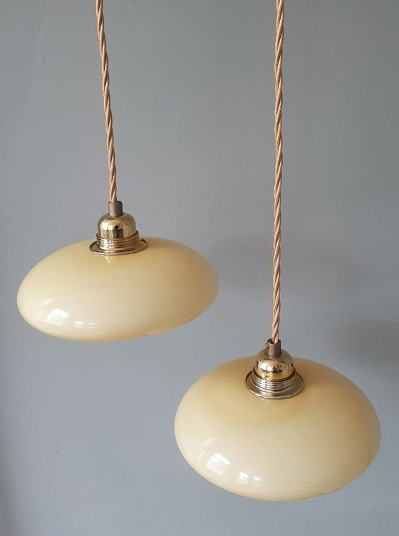 Image 1 of Vintage French pendant lamp set - of pastel yellow opaline glass.