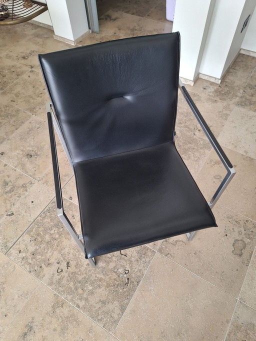 6 stylish black leather chairs from the with Arco