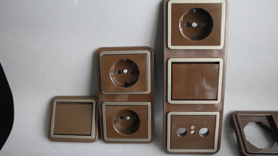 Image 1 of Large collection of vintage brown light and socket switches from the 1970s, brand BLASS.