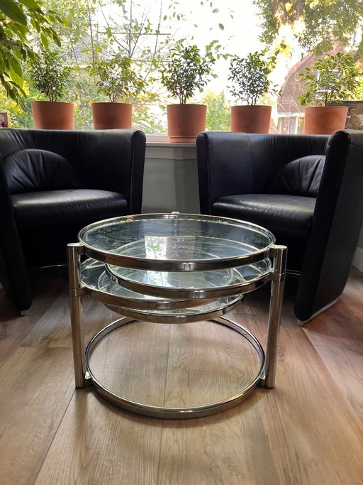 Unique vintage Italian coffee table with chrome frame and four round glass tops. Three outer tops can be moved separately.