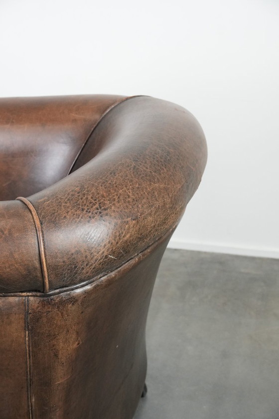 Image 1 of Sturdy and characterful vintage sheepskin club armchair