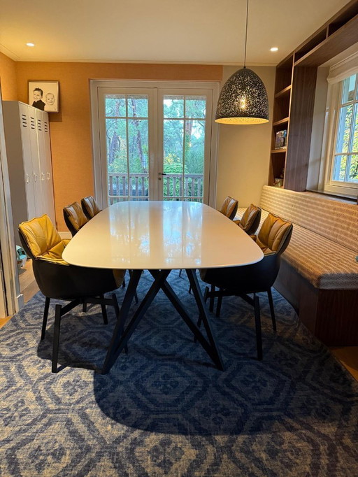 Walter Knoll design Seito dining table with six B&B Italia Husk Swivel Dining Chair by Patricia Urquiola