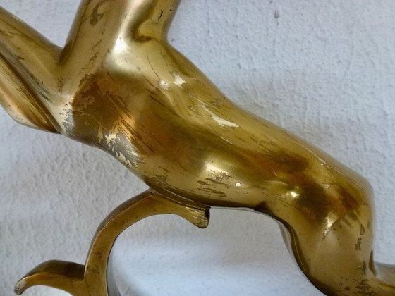 Image 1 of Beautiful brass gazelle on a lacquered wooden base.