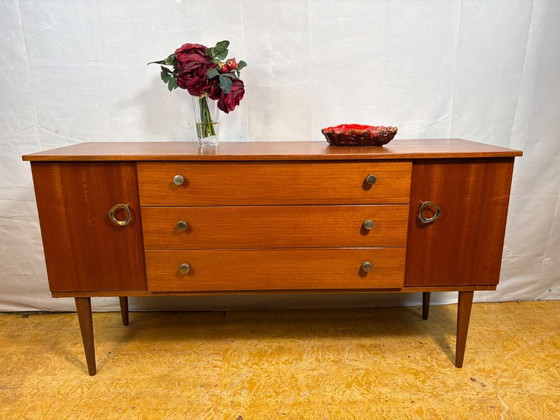 Image 1 of Mid Century Retro Teak Small Sideboard by Schreiber (Circa 1960)  A stylish and compact mid century modern teak sideboard by Sch