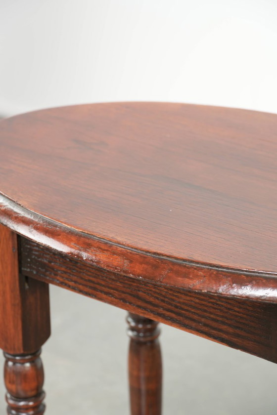 Image 1 of Antique oval English oak side table from the early 20th century with beautiful colors