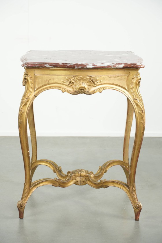 Image 1 of Antique French side table/center table from the 19th century with a gold-colored wooden frame and an original marble tabletop.