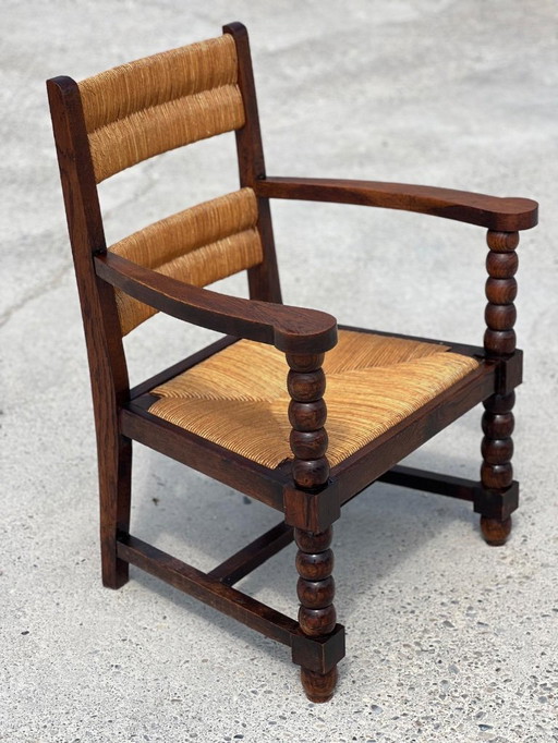 Pair of stained oak and straw armchairs, French work 1950