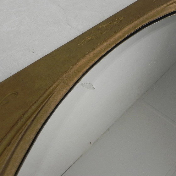 Image 1 of Gold oval mirror with cut edge, 1950s