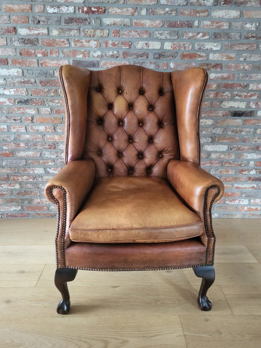Fauteuil à oreilles de style Chesterfield