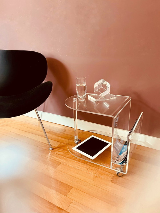 Image 1 of 80's Acrylic side table on wheels + reading material