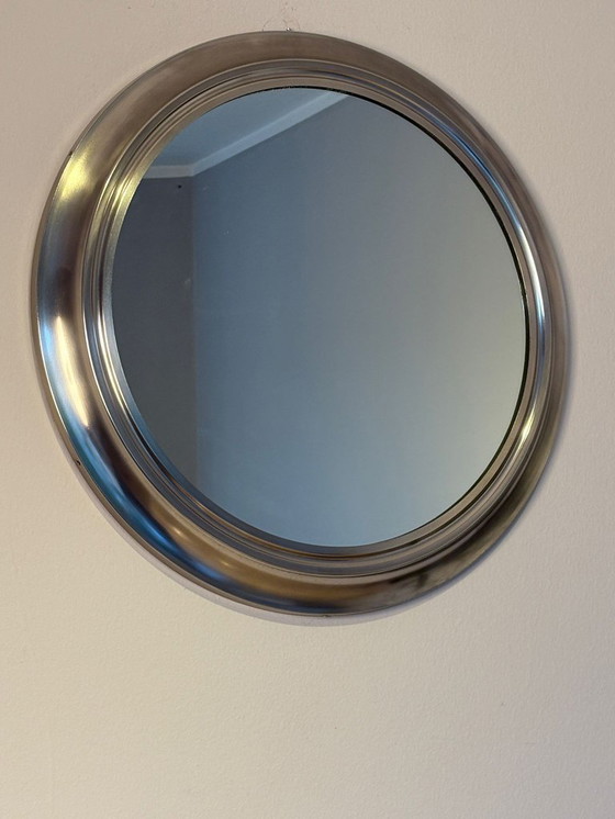 Image 1 of round mirror with metal frame, dating back to the 1970s