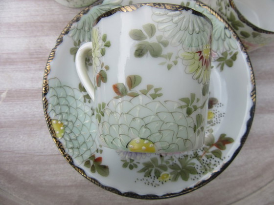 Image 1 of Vintage 4 Asian miniature cups and saucers with gold tone rims new condition