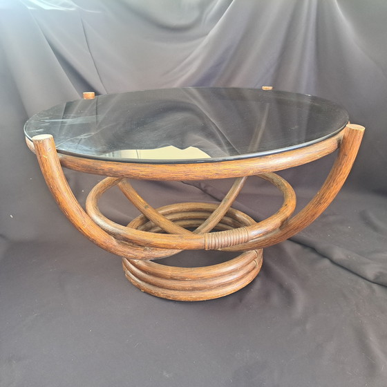Image 1 of Vintage rattan coffee table with smoked glass top - Hollywood Regency style