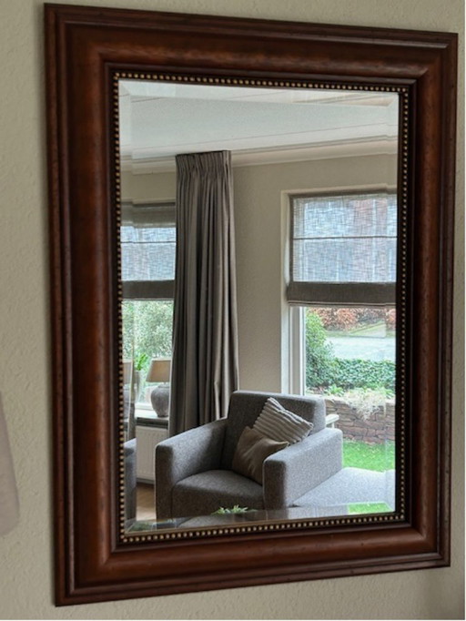 Miroir avec cadre en bois fin et bord facetté poli