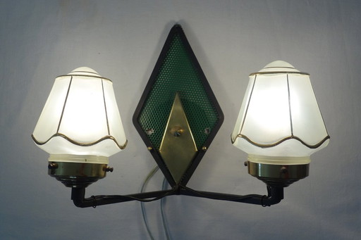 Rare double perforated metal wall light from the 50s