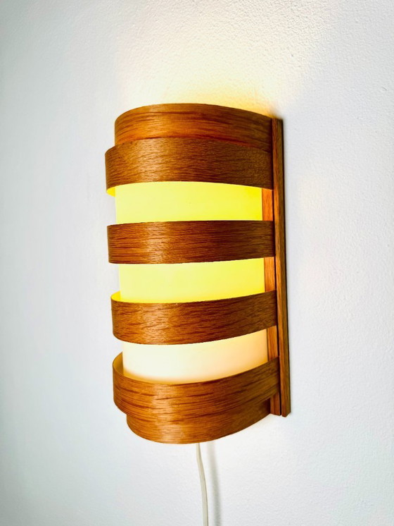 Image 1 of Elegant mid-century wall lamp crafted from curved pine veneer, produced in Sweden during the 1960s.