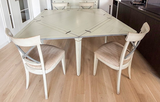 Image 1 of Handkerchief table with 4 leaves and 4 chairs