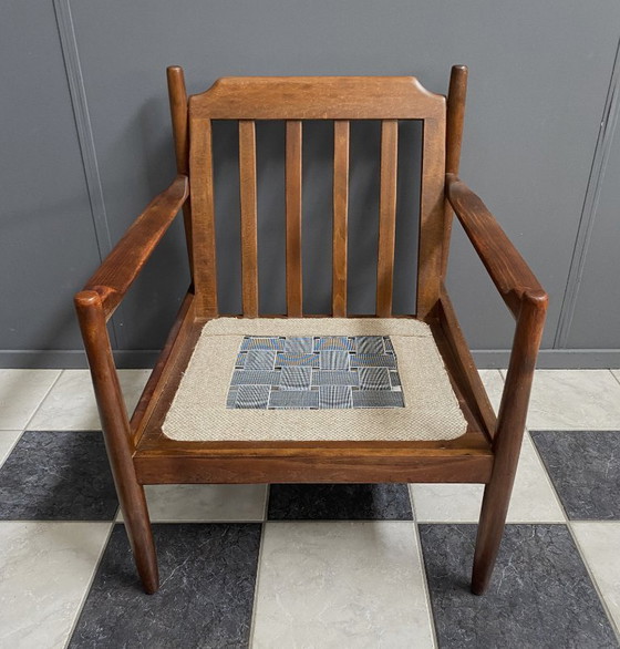 Image 1 of Gele stoffen en houten relaxstoel uit de jaren 60.