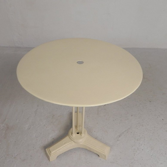 Bistro table with cast iron legs and round steel top, 1930s – Dining tables (photo 13 of 22)