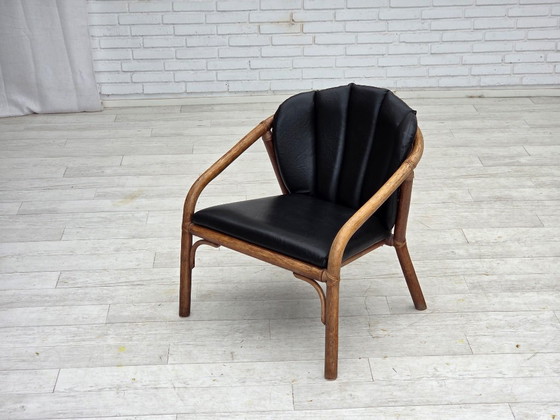 Image 1 of 1970s, Danish armchair, rattan, black artificial leather.
