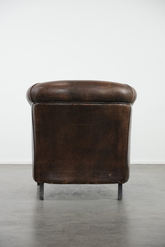 Image 1 of Sturdy and characterful vintage sheepskin club armchair