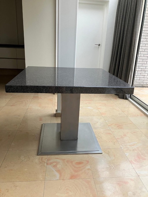 Dining table with natural stone top