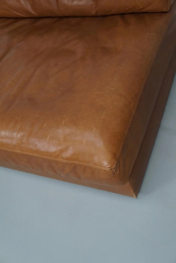 Image 1 of De Sede DS 76 loungestoel / slaapbank van cognackleurig leer, Zwitserland, jaren 1970