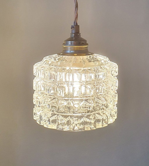 Mid-century vintage pendant lamp of thick, textured glass.