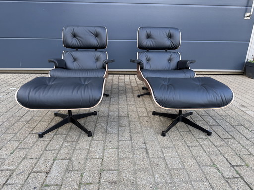 2 poltrone lounge Vitra Eames XL originali con poggiapiedi, in pregiata pelle nera e palissandro Santos, NUOVE!!