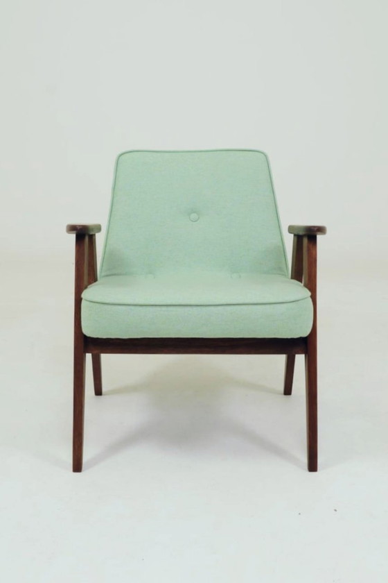 Image 1 of Scandinavische fauteuil met pistachekleurige pastel wollen stof en eikenhout