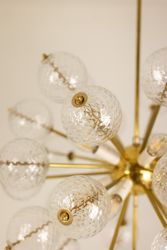 Image 1 of Kamenicky Senov, editor. Pair of brass and glass chandeliers. Circa 1970