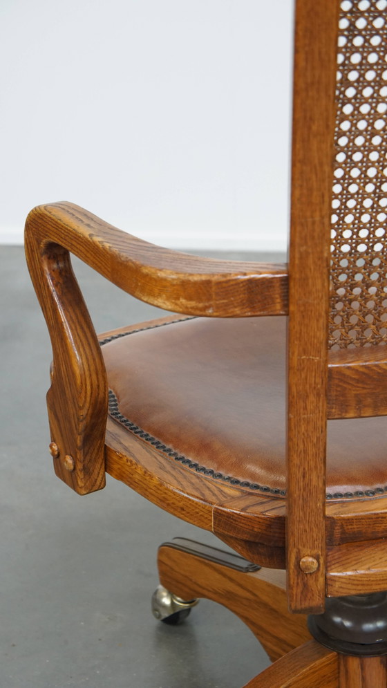 Image 1 of Cognac Colored Leather Office Chair on Wheels with Wood and a Wicker Matted Backrest