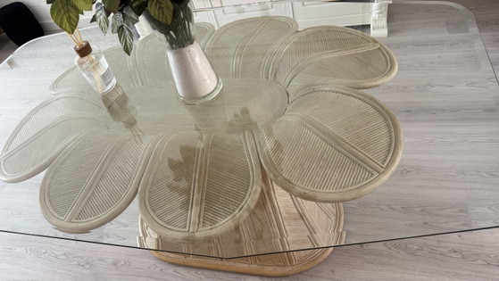 Image 1 of Beautiful glass dining table with a unique rattan base