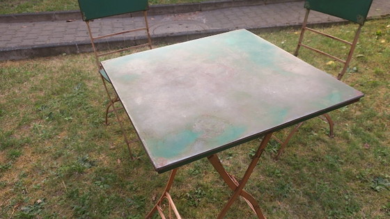 Image 1 of Table de jardin et 2 chaises en fer peint vieilli, style années 1960