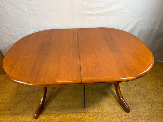 Image 1 of Mid Century Retro Teak Oval Danish Extending Dining Table (Circa 1960–1970)  A stunning mid century modern teak oval extending d
