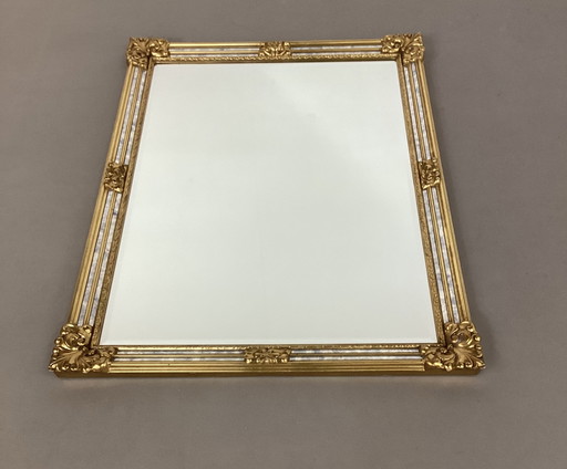 Gilded Deknudt facet mirror with fume edges