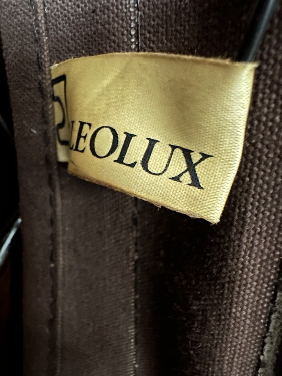 Image 1 of Vintage Leolux bruinkleurige lederen/eiken ‘Lounge chair and ottoman’ van Harry de Groot - 1970