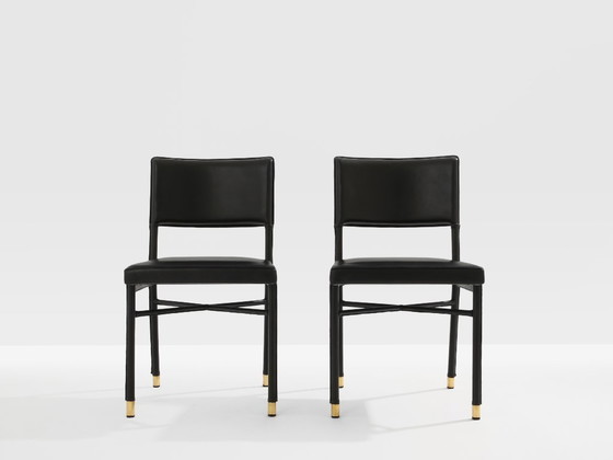 Image 1 of Jacques Quinet paar leren bijzettafels met zadelstiksel en messing details, 1950