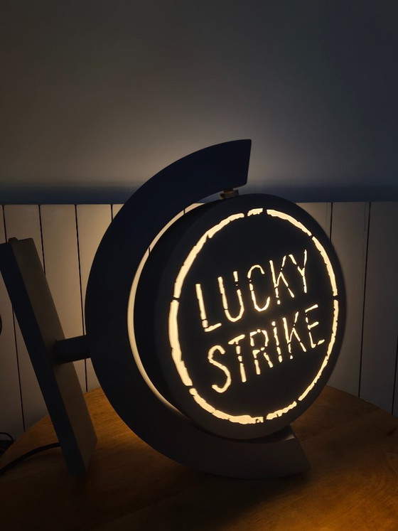 Image 1 of Vintage draaiend lichtreclamebord Lucky Strike