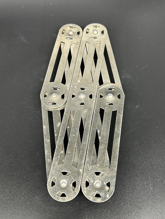 Image 1 of 1950s metal trivet
