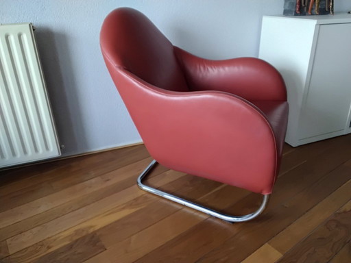Red leather armchair by Wittmann.