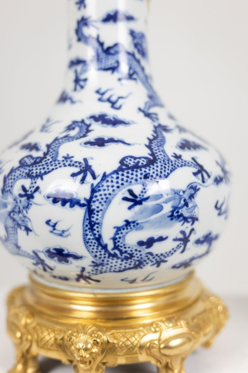 Pair of porcelain lamps decorated with dragons and gilt bronze. Circa 1880