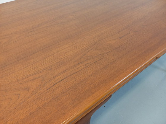 Image 1 of Vintage Scandinavian rectangular dining table by Ejvind A. Johansson from the 50s and 60s in teak with integrated extensions