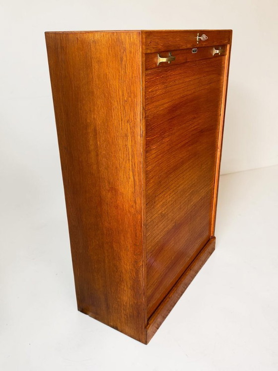 Image 1 of Antique German oak roll-top wardrobe with original key and working wooden roll-top. Made around 1920–1935