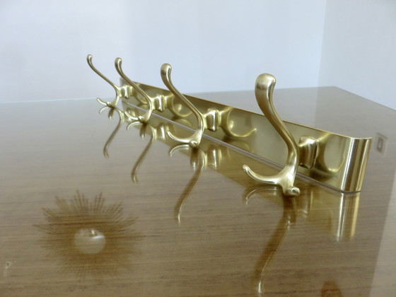 Image 1 of Large wall-mounted coat rack in gilded aluminum, France, 1970
